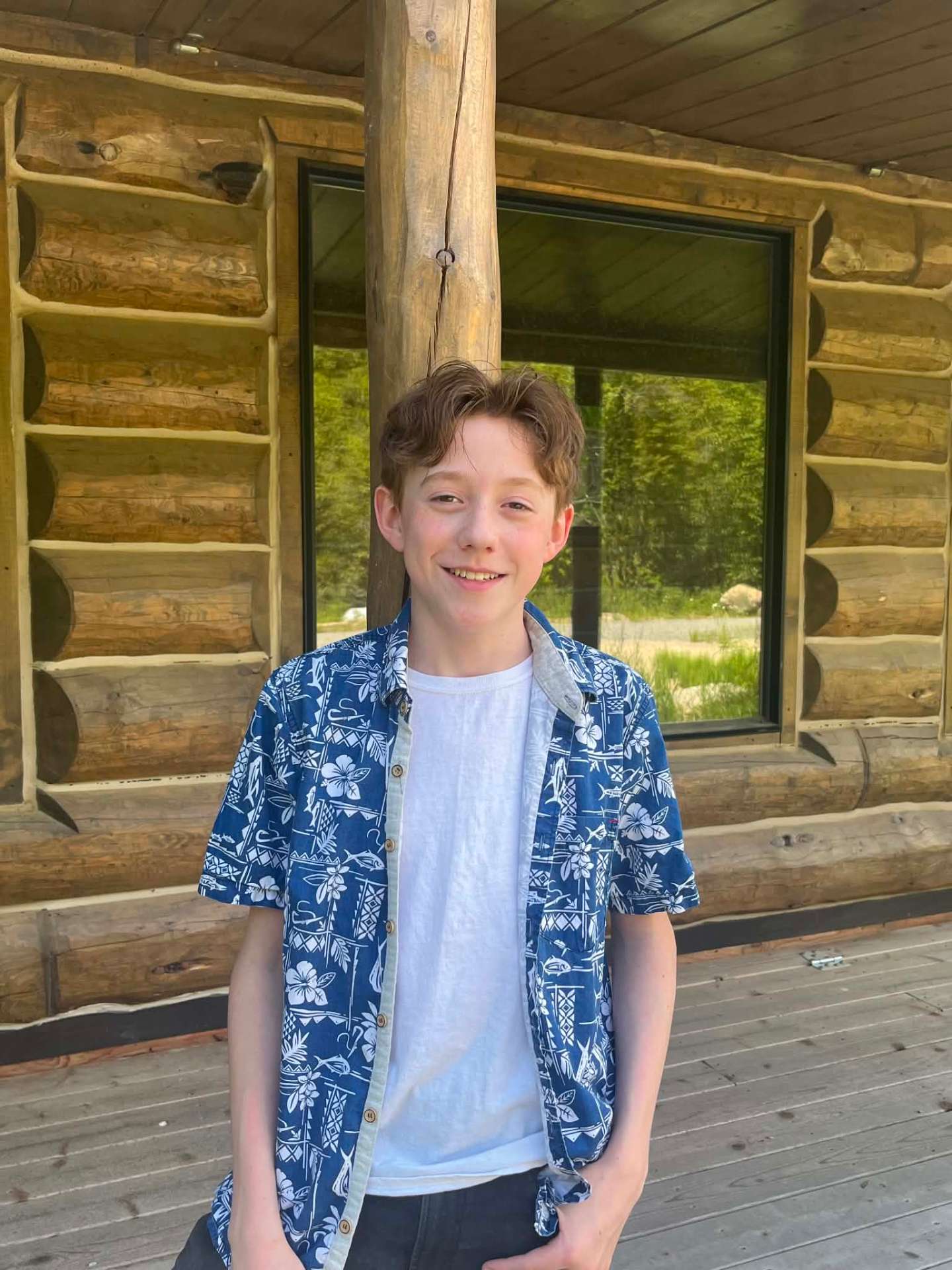 Hiram smiling outside the cabin